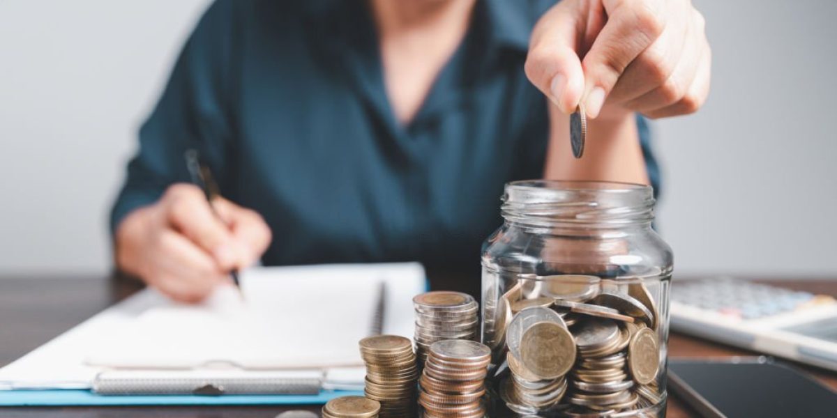 Saving investment banking finance concept. Stack of coins with piggy bank on the table. Growth of loan and investment business idea. Asset Management, Funds, Liabilities, Deposits, Income, Successful.